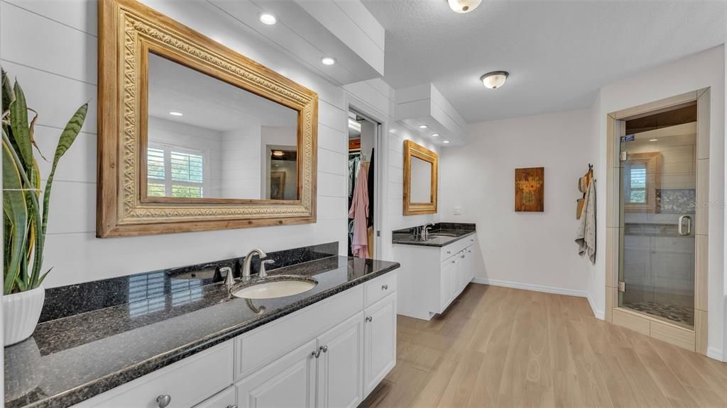 Bathroom, Dual Sink Vanities, Glass Shower, Interior, Recessed Lighting, Wood Texture Flooring
