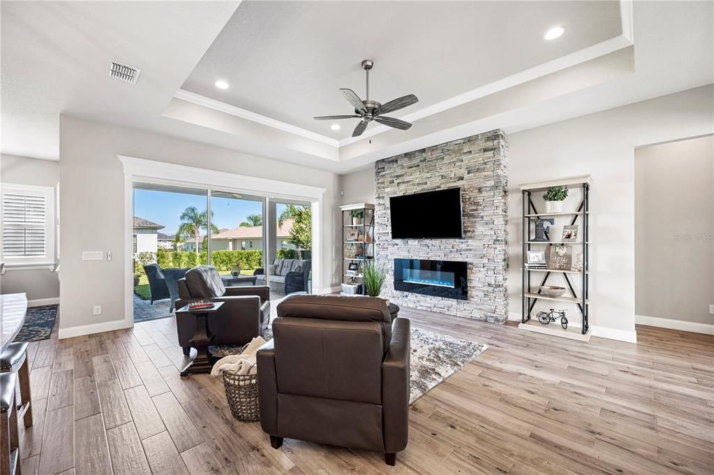 Fireplace, Interior, Living room, Recessed Lighting, Stone Walls, Wood Texture Flooring