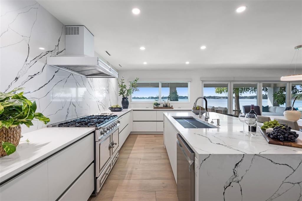 Interior, Kitchen, Marble Walls, Pendant Lights, Recessed Lighting, Stainless Steel Appliances, Water, Wood Texture Flooring