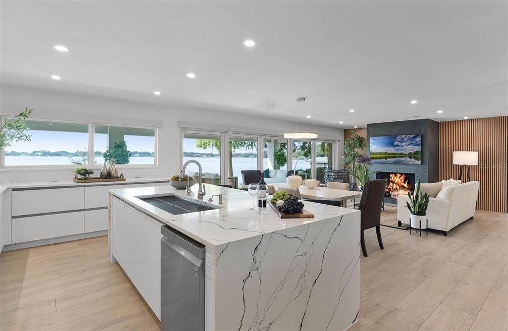 Dining room, Fireplace, Interior, Kitchen, Living room, Pendant Lights, Recessed Lighting, Water, Wood Texture Flooring