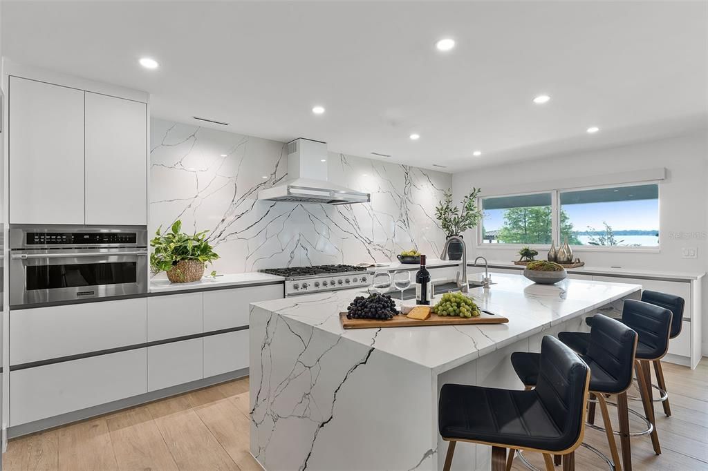 Interior, Kitchen, Marble Walls, Recessed Lighting, Stainless Steel Appliances, Wood Texture Flooring