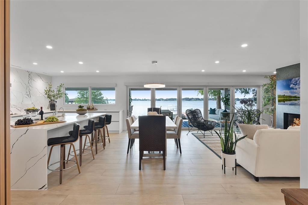 Dining room, Fireplace, Interior, Living room, Pendant Lights, Recessed Lighting, Water, Wood Texture Flooring