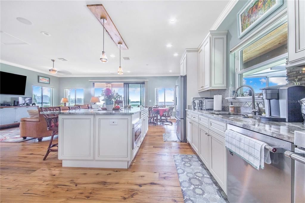 Dining room, Interior, Kitchen, Living room, Pendant Lights, Recessed Lighting, Stainless Steel Appliances, Wood Texture Flooring