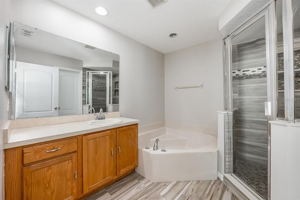Bathroom, Dual Sink Vanities, Interior, Recessed Lighting, Wood Texture Flooring
