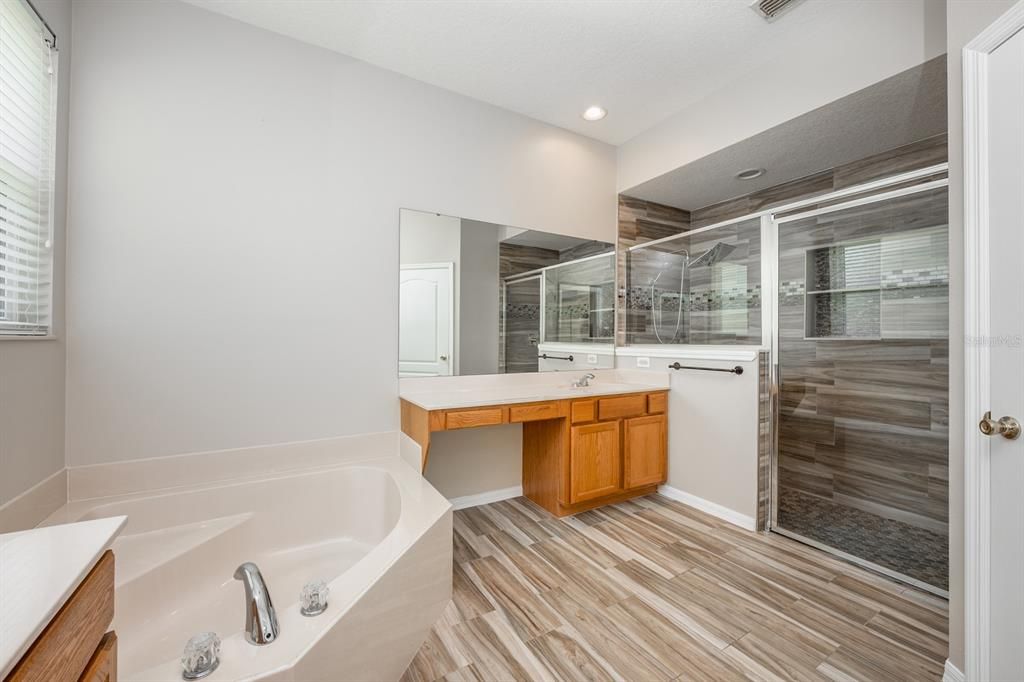 Bathroom, Dual Sink Vanities, Glass Shower, Interior, Recessed Lighting, Wood Texture Flooring
