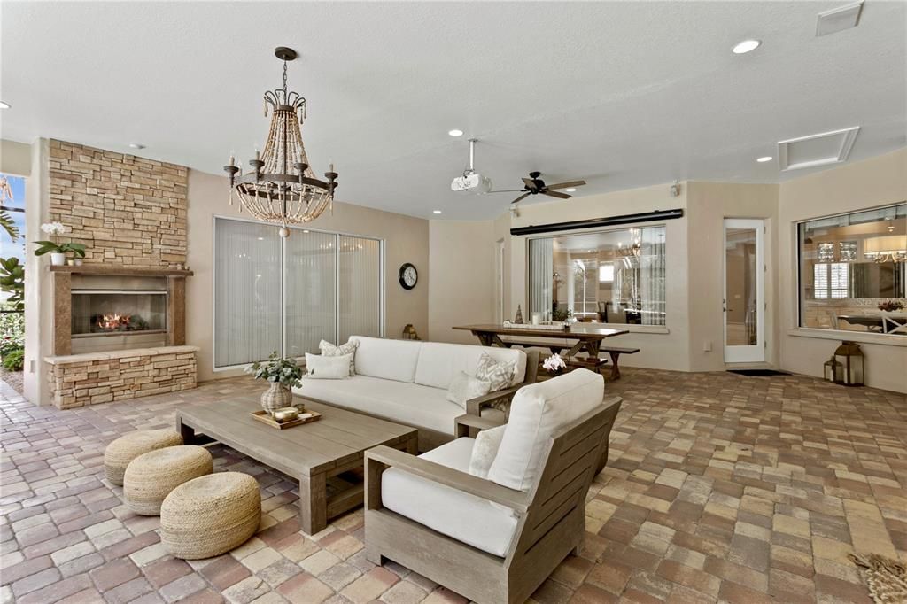 Chandelier, Dining room, Fireplace, Interior, Living room, Pendant Lights, Recessed Lighting, Stone Walls