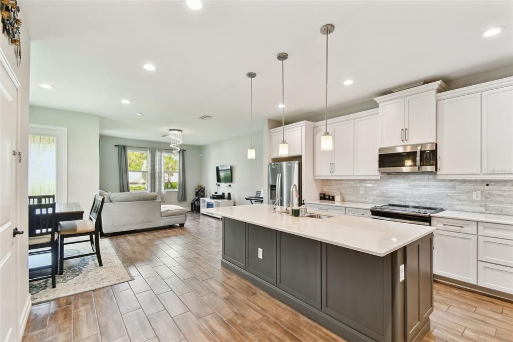 Dining room, Interior, Kitchen, Living room, Pendant Lights, Recessed Lighting, Stainless Steel Appliances, Wood Texture Flooring
