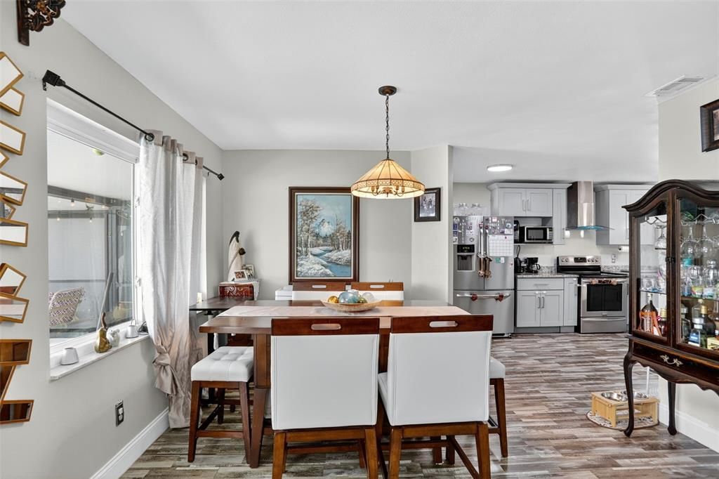 Dining room, Interior, Kitchen, Pendant Lights, Recessed Lighting, Stainless Steel Appliances, Wood Texture Flooring