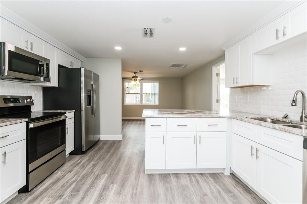 Interior, Kitchen, Recessed Lighting, Stainless Steel Appliances, Wood Texture Flooring