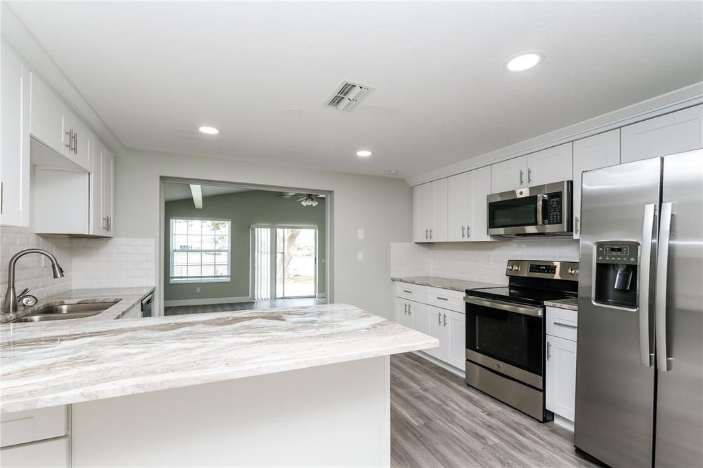 Interior, Kitchen, Recessed Lighting, Stainless Steel Appliances, Wood Texture Flooring