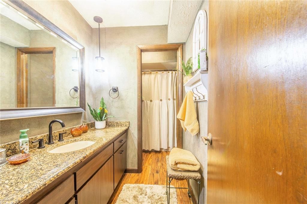 Bathroom, Dual Sink Vanities, Interior, Pendant Lights, Wood Texture Flooring