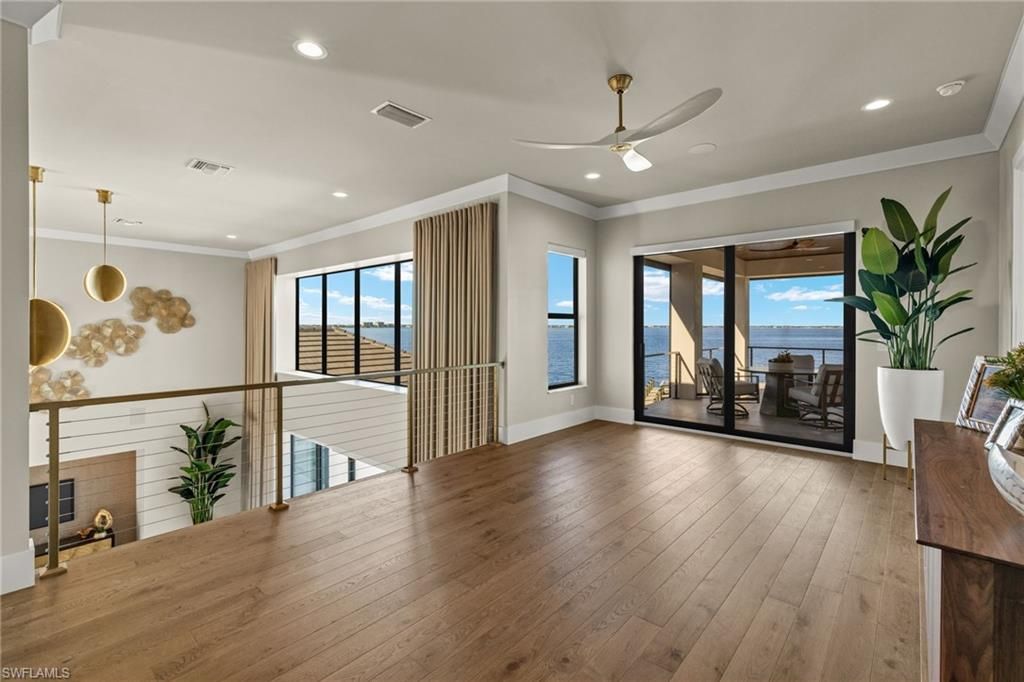 Empty room, Fireplace, Interior, Pendant Lights, Recessed Lighting, Water, Wood Texture Flooring