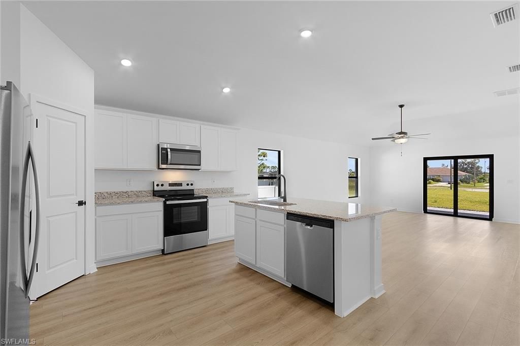 Interior, Kitchen, Recessed Lighting, Stainless Steel Appliances, Wood Texture Flooring