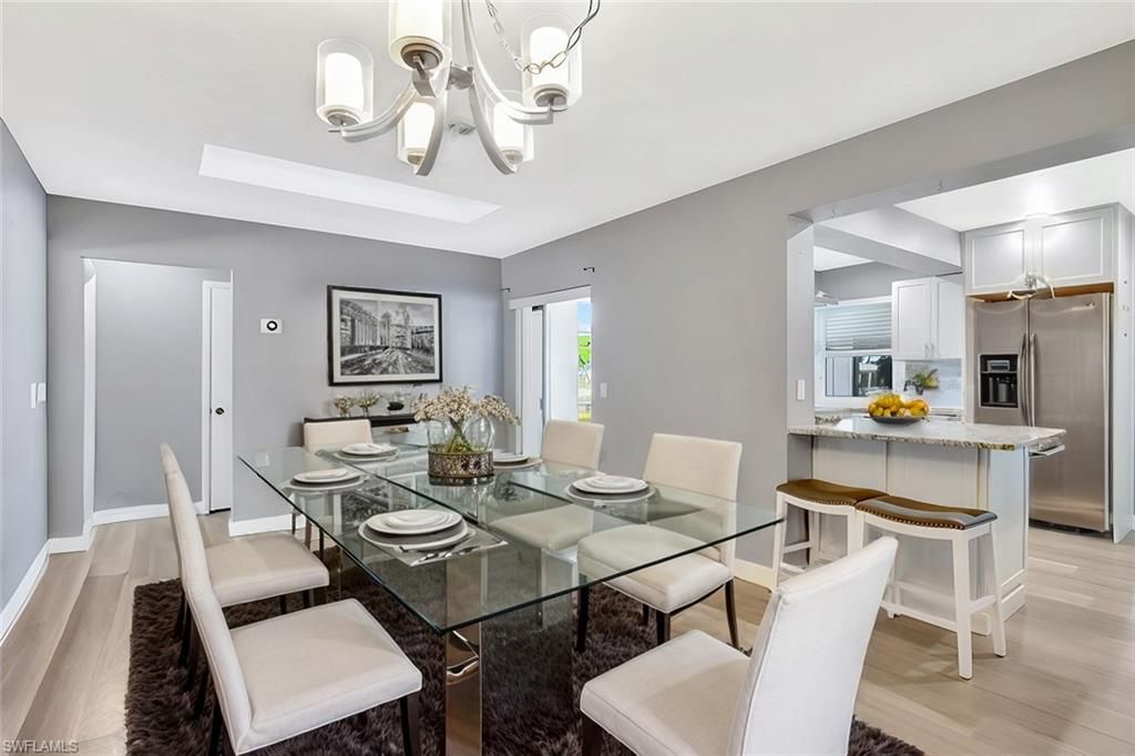 Chandelier, Dining room, Interior, Kitchen, Stainless Steel Appliances, Wood Texture Flooring