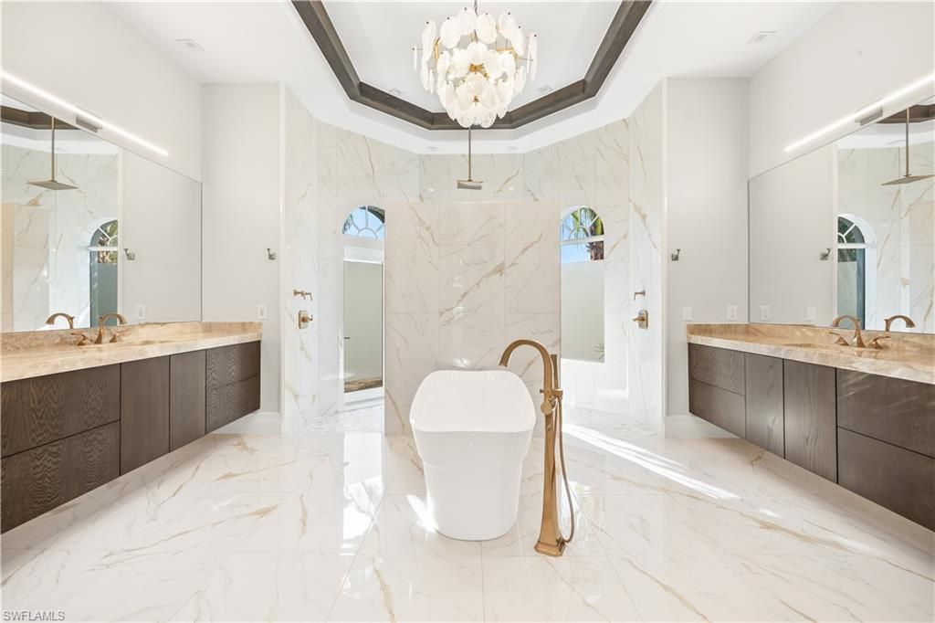 Bathroom, Chandelier, Dual Sink Vanities, Free Standing Baths, Interior, Marble, Marble Walls