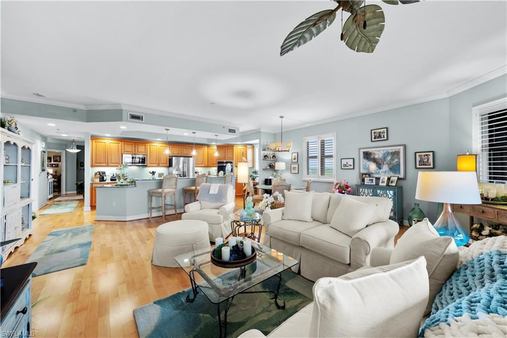 Chandelier, Dining room, Interior, Kitchen, Living room, Pendant Lights, Recessed Lighting, Stainless Steel Appliances, Wood Texture Flooring