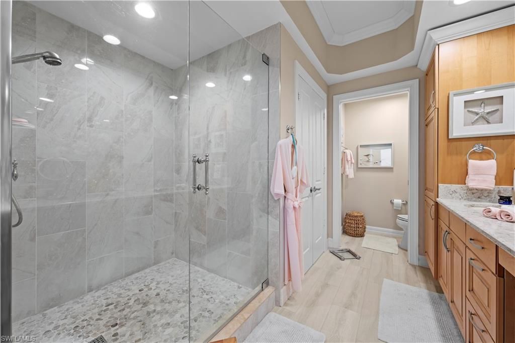 Bathroom, Glass Shower, Interior, Marble Walls, Recessed Lighting, Wood Texture Flooring
