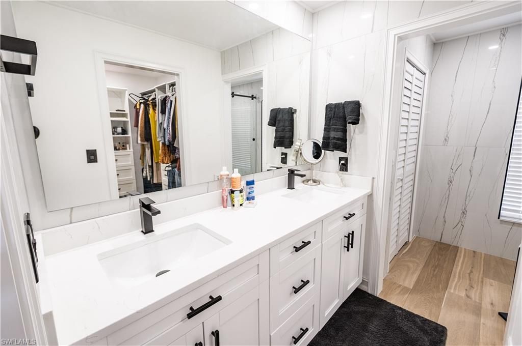 Bathroom, Dual Sink Vanities, Interior, Marble Walls, Walk-in Closets, Wood Texture Flooring