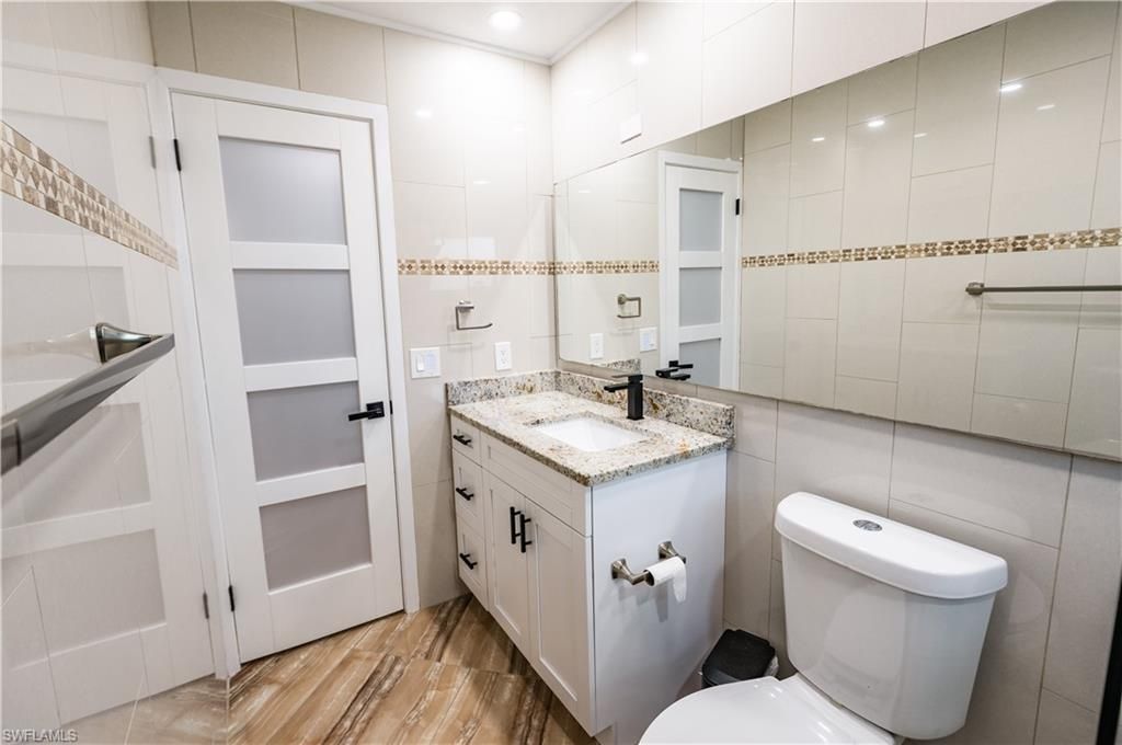 Bathroom, Dual Sink Vanities, Interior, Recessed Lighting, Wood Texture Flooring