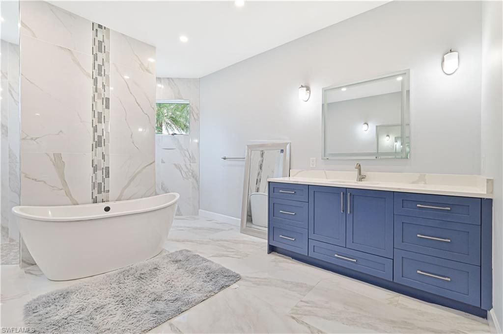 Bathroom, Dual Sink Vanities, Free Standing Baths, Interior, Marble, Marble Walls, Recessed Lighting