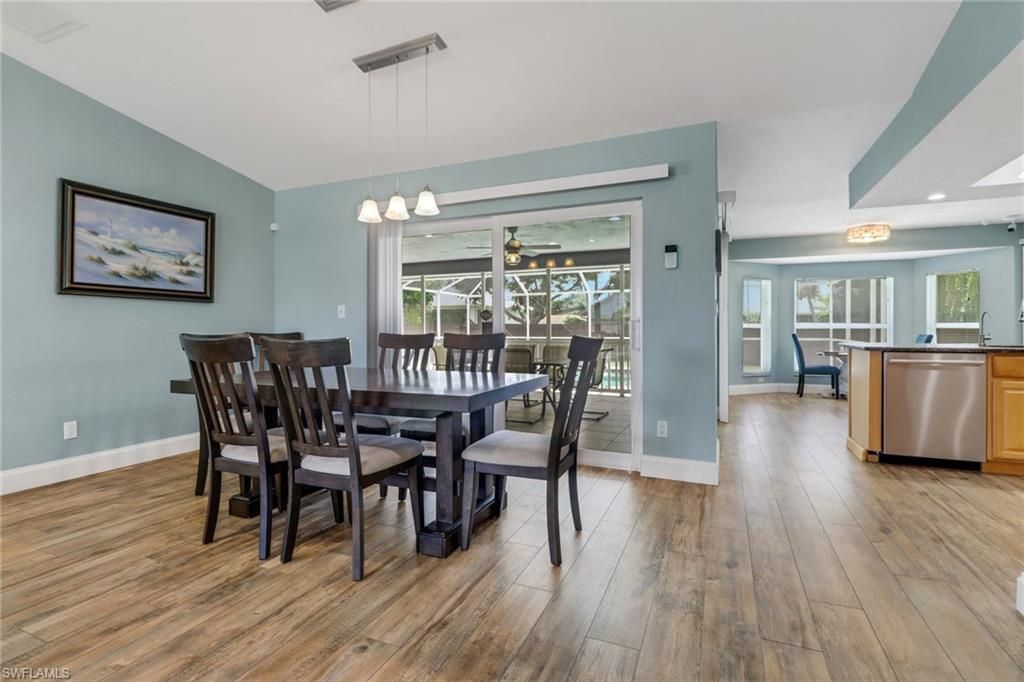 Dining room, Interior, Kitchen, Pendant Lights, Recessed Lighting, Stainless Steel Appliances, Wood Texture Flooring