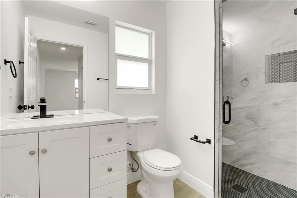 Bathroom, Glass Shower, Interior, Marble Walls, Recessed Lighting, Wood Texture Flooring