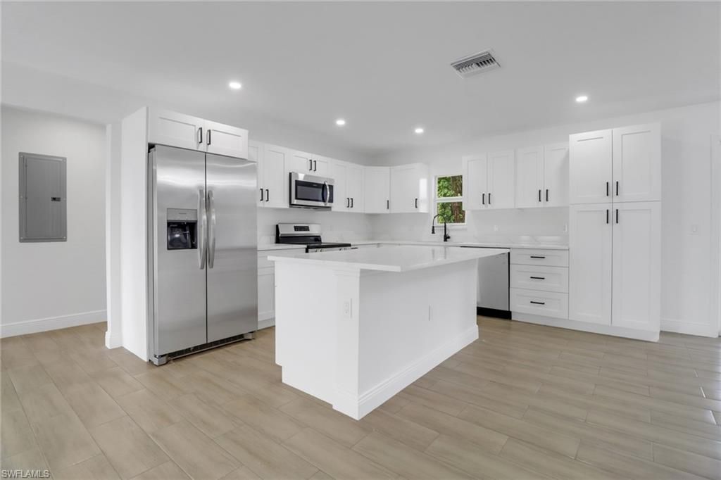 Interior, Kitchen, Recessed Lighting, Stainless Steel Appliances, Wood Texture Flooring