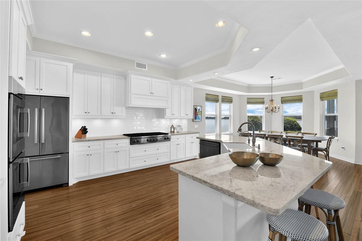 Dining room, Interior, Kitchen, Pendant Lights, Recessed Lighting, Stainless Steel Appliances, Wood Texture Flooring