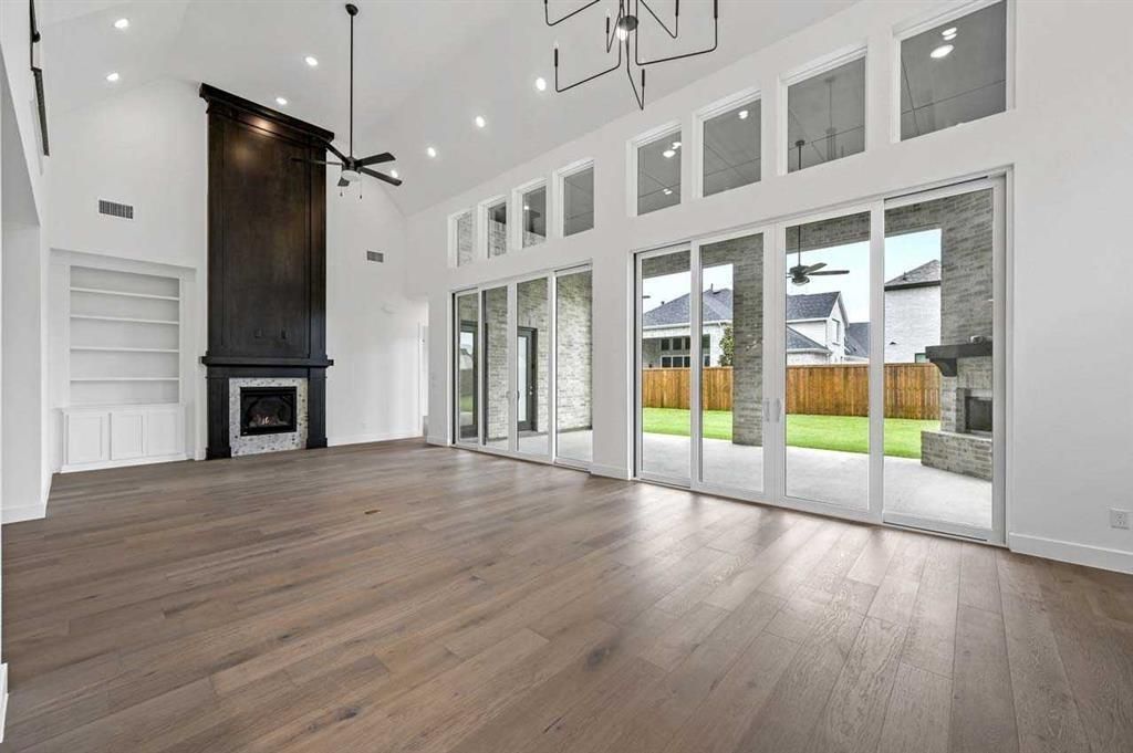 Empty room, Fireplace, Interior, Pendant Lights, Recessed Lighting, Wood Texture Flooring