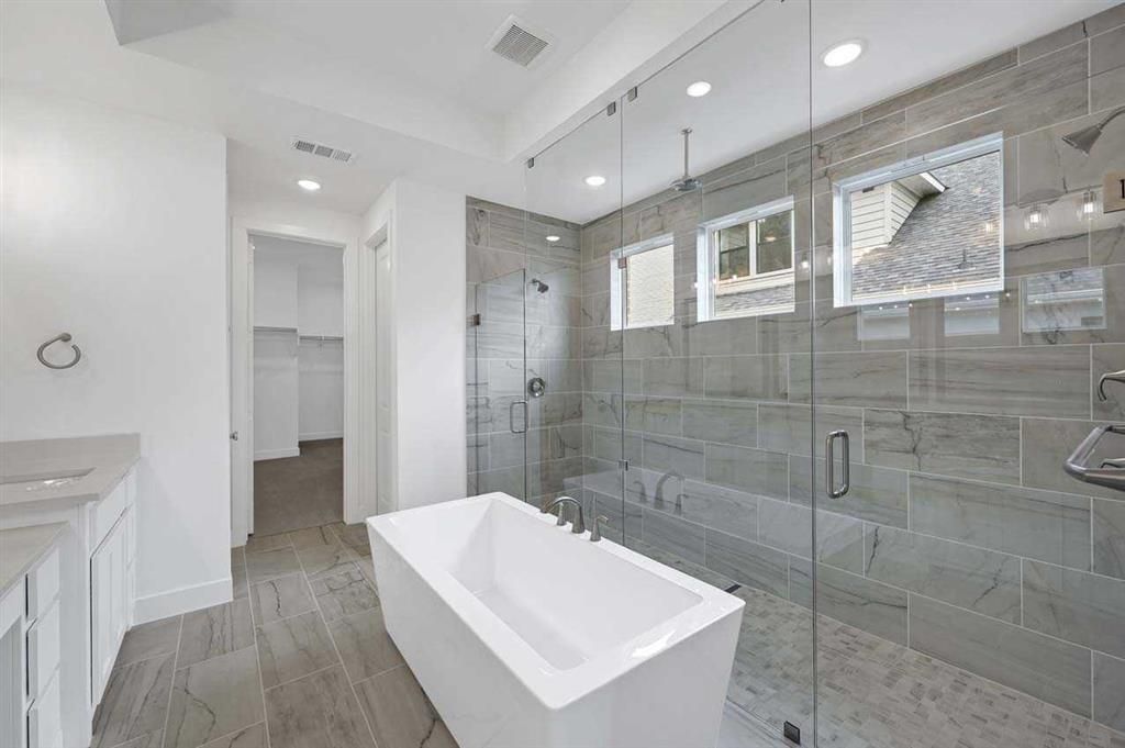 Bathroom, Dual Sink Vanities, Free Standing Baths, Glass Shower, Interior, Recessed Lighting, Wood Texture Flooring