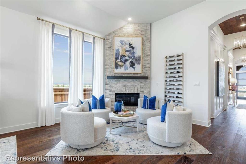 Chandelier, Fireplace, Interior, Living room, Pendant Lights, Recessed Lighting, Stone Walls, Wood Texture Flooring