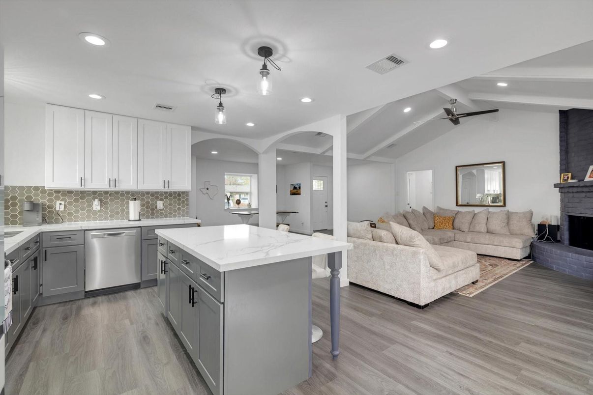 Fireplace, Interior, Kitchen, Living room, Recessed Lighting, Stainless Steel Appliances, Wood Texture Flooring