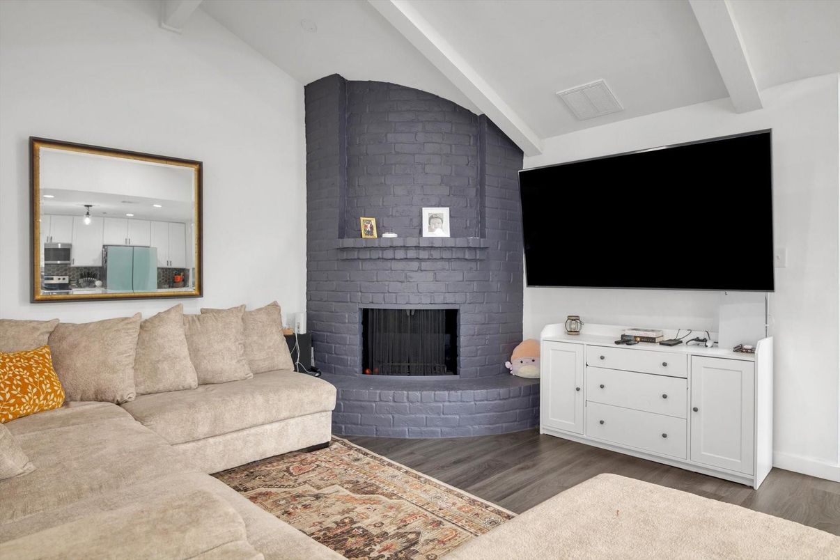 Fireplace, Interior, Living room, Recessed Lighting, Stone Walls, Wood Texture Flooring
