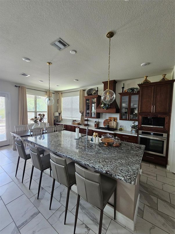 Dining room, Interior, Kitchen, Marble, Pendant Lights, Recessed Lighting, Stainless Steel Appliances