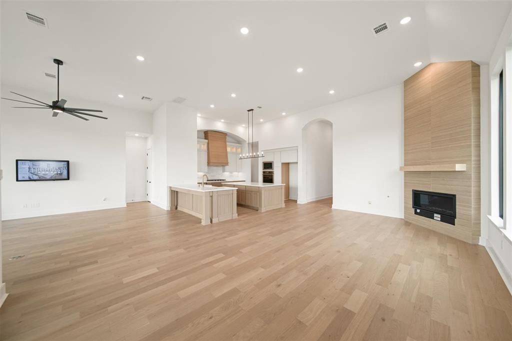 Empty room, Fireplace, Interior, Kitchen, Pendant Lights, Recessed Lighting, Wood Texture Flooring