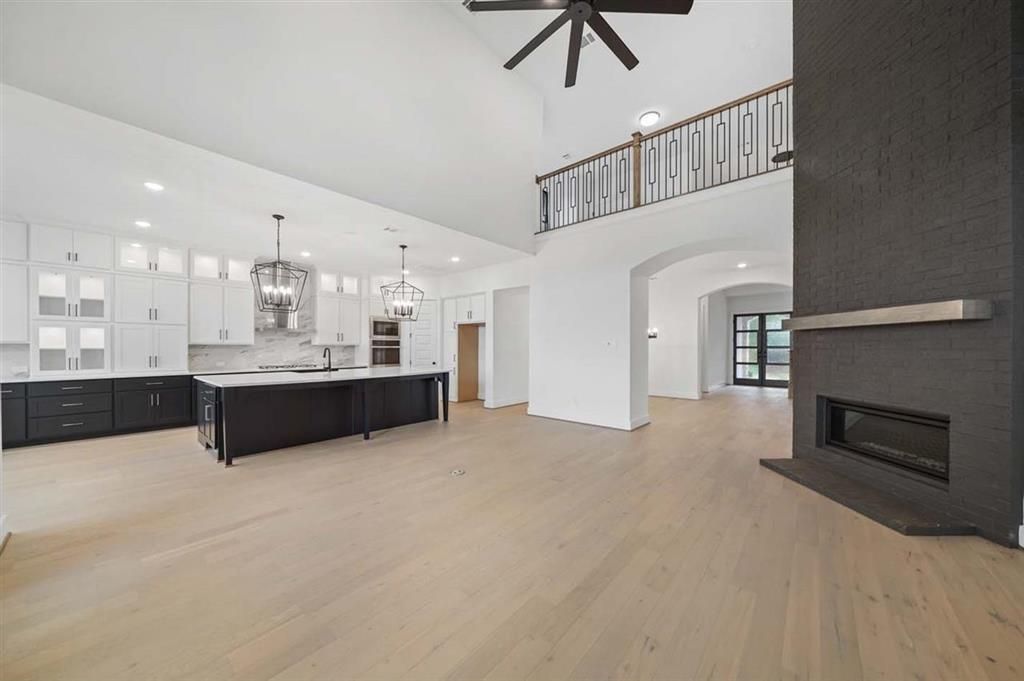 Chandelier, Fireplace, Interior, Kitchen, Pendant Lights, Recessed Lighting, Wood Texture Flooring