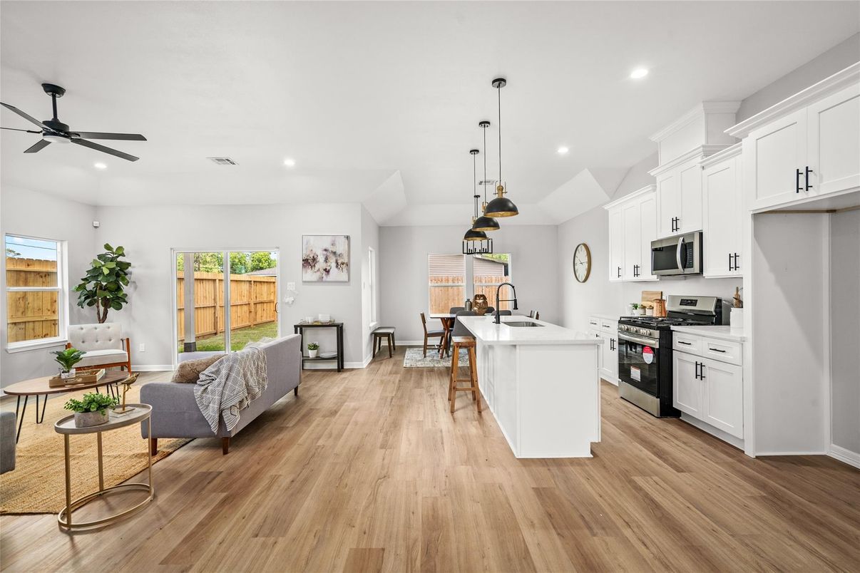 Dining room, Interior, Kitchen, Pendant Lights, Recessed Lighting, Stainless Steel Appliances, Wood Texture Flooring