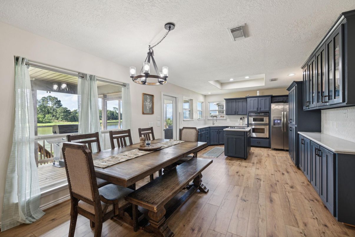 Chandelier, Dining room, Interior, Kitchen, Recessed Lighting, Stainless Steel Appliances, Wood Texture Flooring