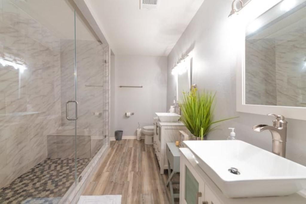 Bathroom, Glass Shower, Interior, Marble Walls, Wood Texture Flooring