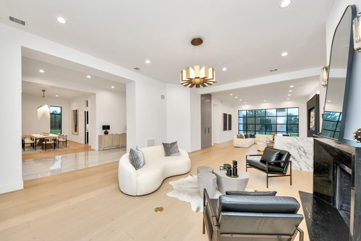 Dining room, Fireplace, Interior, Living room, Pendant Lights, Recessed Lighting, Wood Texture Flooring