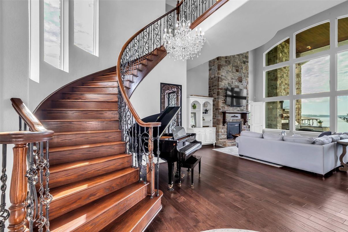Chandelier, Fireplace, Interior, Living room, Piano, Stone Walls, Wood Texture Flooring