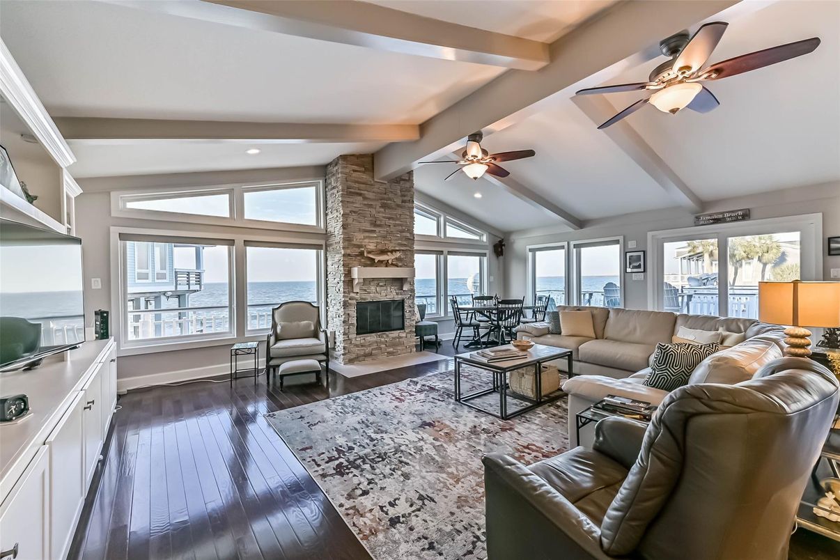 Fireplace, Interior, Living room, Recessed Lighting, Stone Walls, Water, Wood Texture Flooring