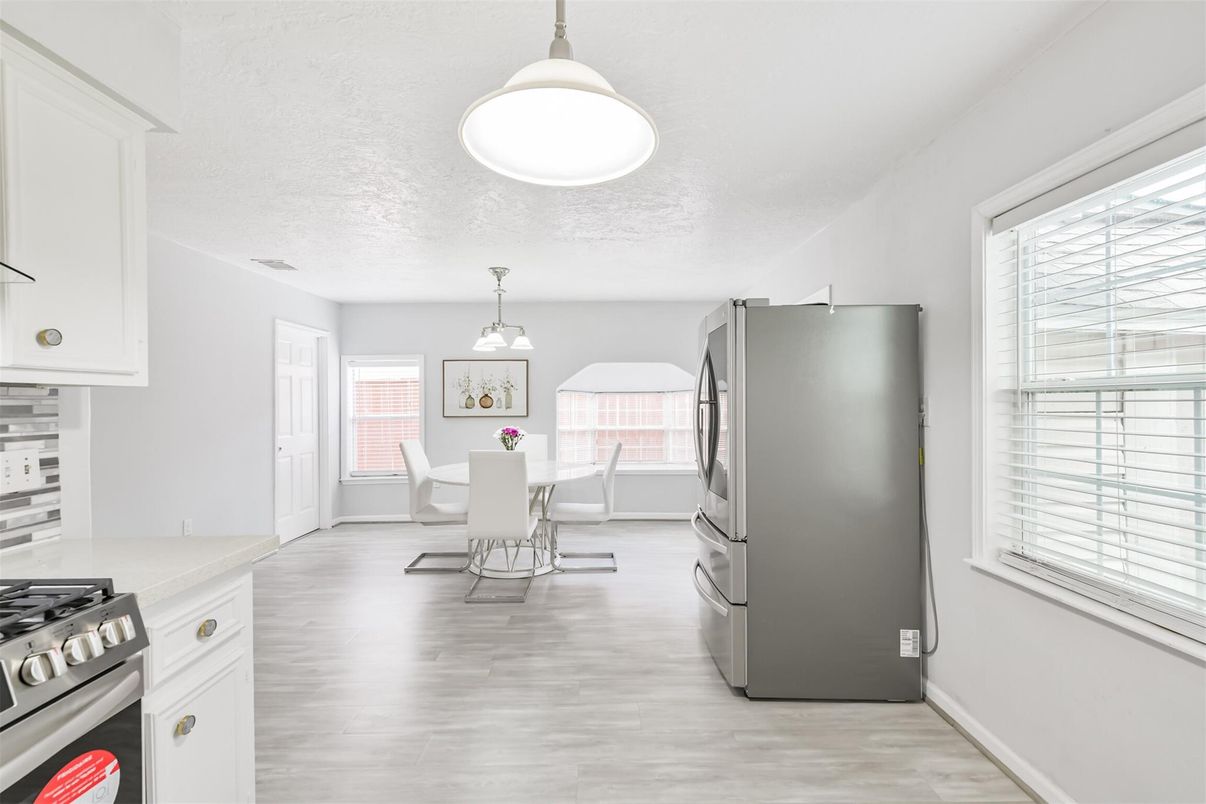 Dining room, Interior, Kitchen, Pendant Lights, Stainless Steel Appliances, Wood Texture Flooring