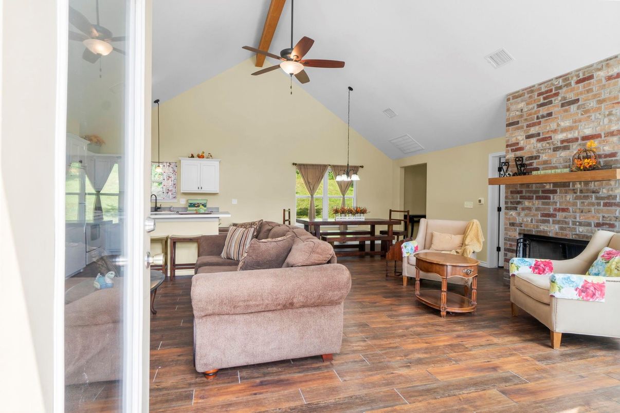 Dining room, Fireplace, Interior, Living room, Pendant Lights, Stone Walls, Wood Texture Flooring