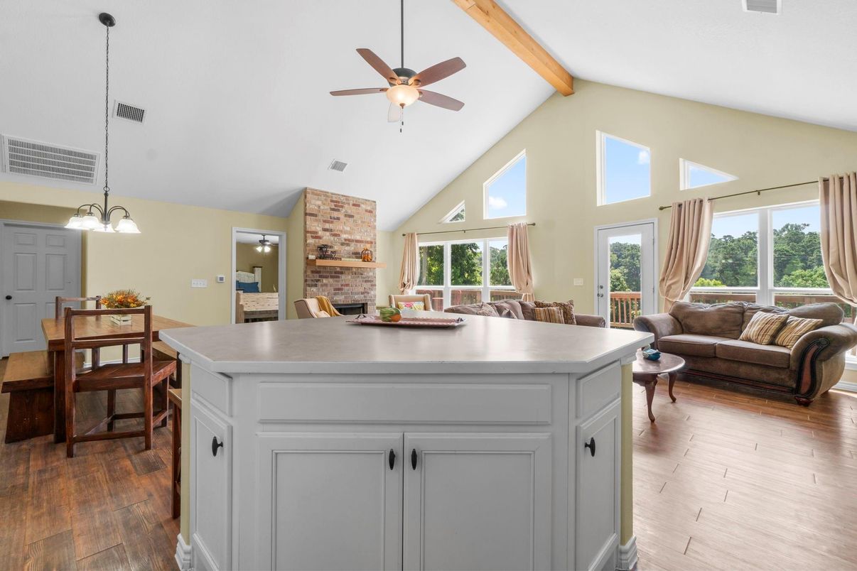 Dining room, Fireplace, Interior, Pendant Lights, Stone Walls, Wooden Beams, Wood Texture Flooring