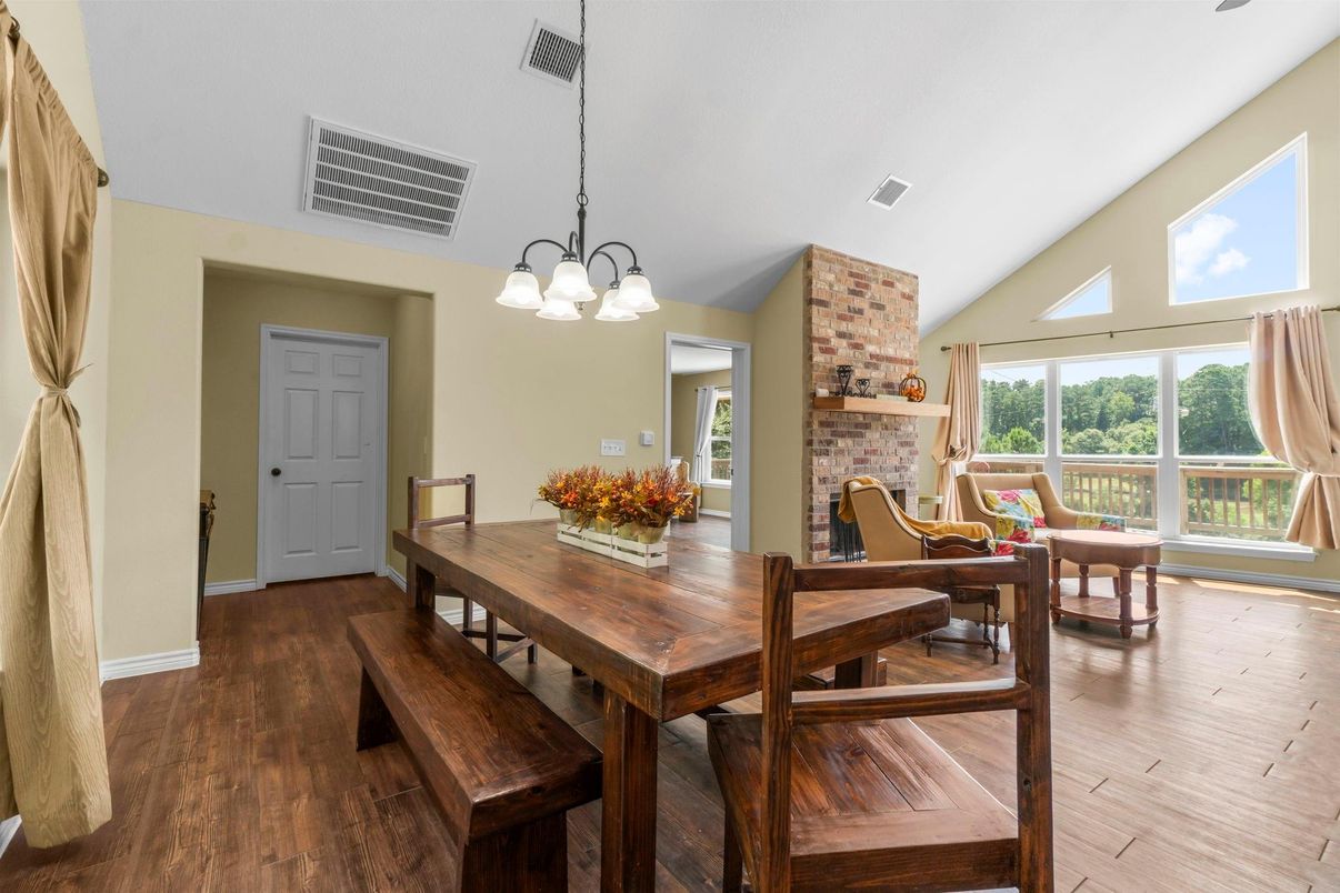 Chandelier, Dining room, Fireplace, Interior, Pendant Lights, Stone Walls, Wood Texture Flooring
