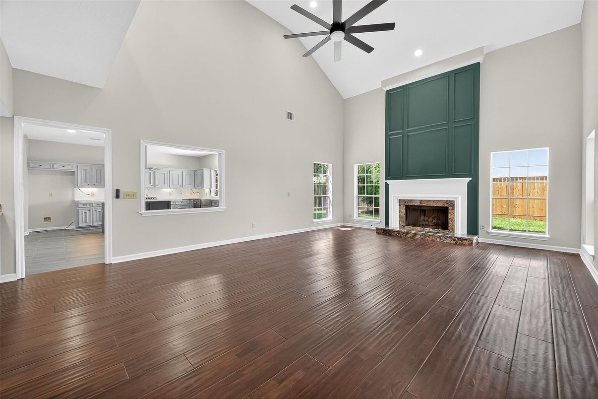 Empty room, Fireplace, Interior, Kitchen, Recessed Lighting, Wood Texture Flooring