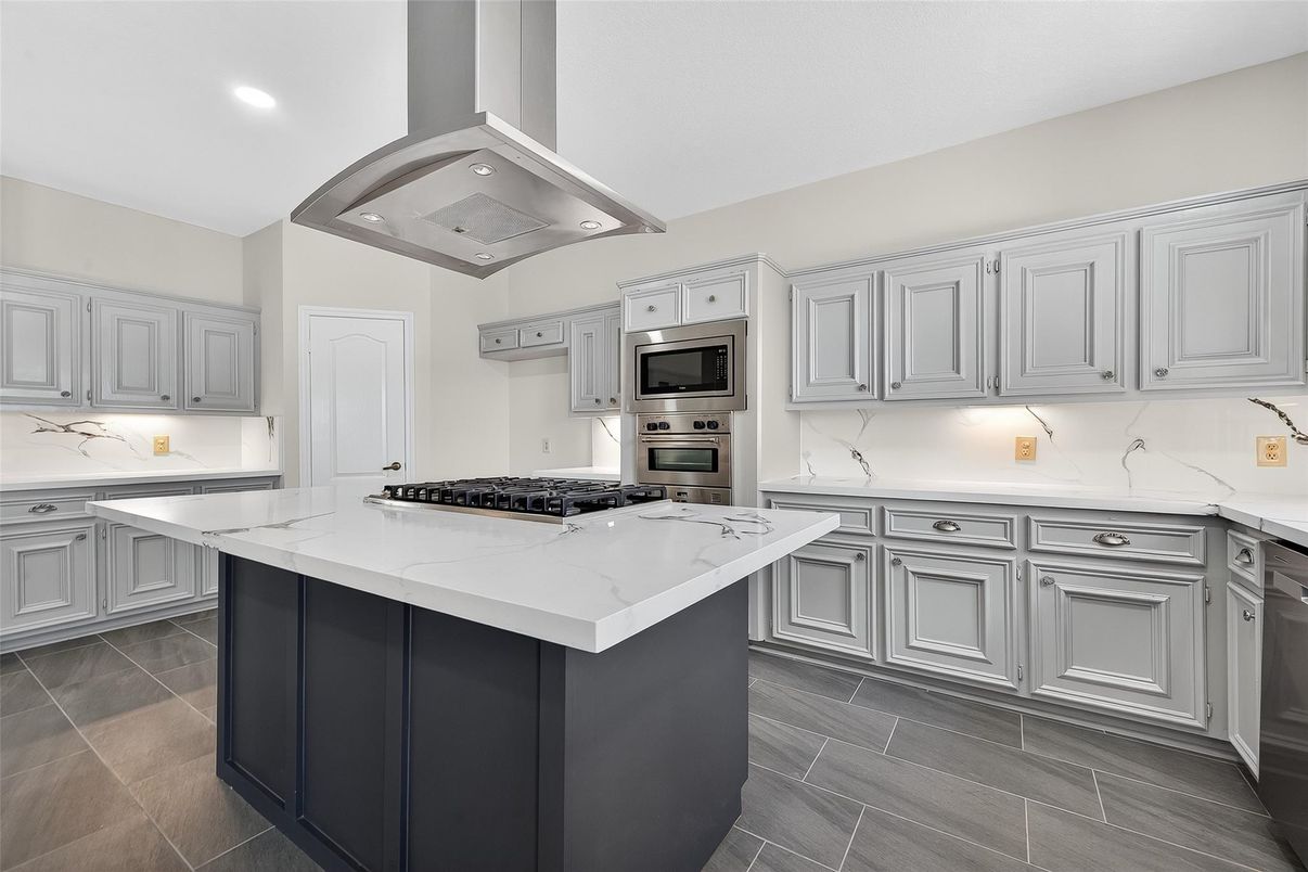 Interior, Kitchen, Marble Walls, Recessed Lighting, Stainless Steel Appliances