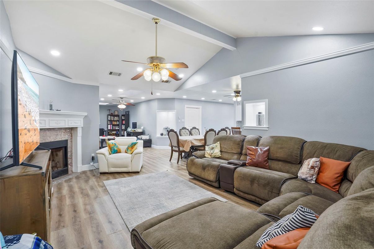 Dining room, Fireplace, Interior, Living room, Recessed Lighting, Wood Texture Flooring