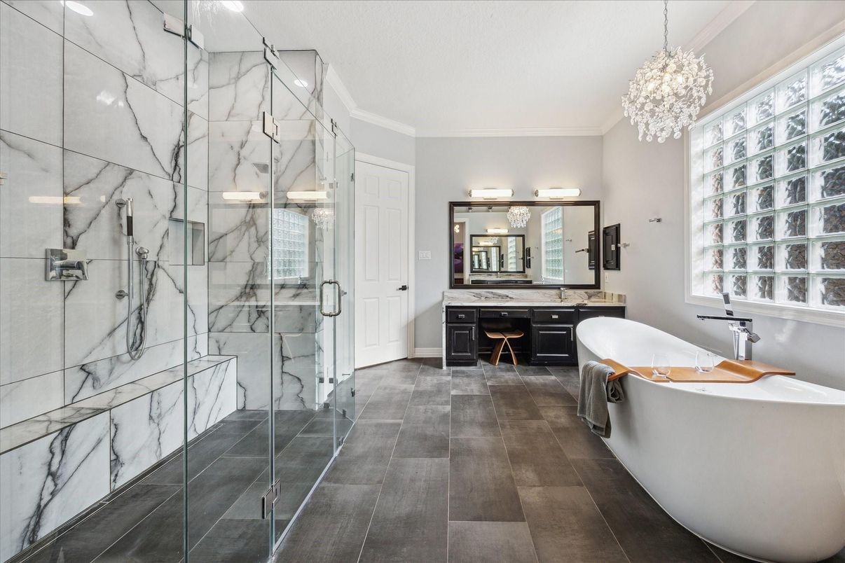 Bathroom, Chandelier, Dual Sink Vanities, Free Standing Baths, Glass Shower, Interior, Marble Walls, Pendant Lights